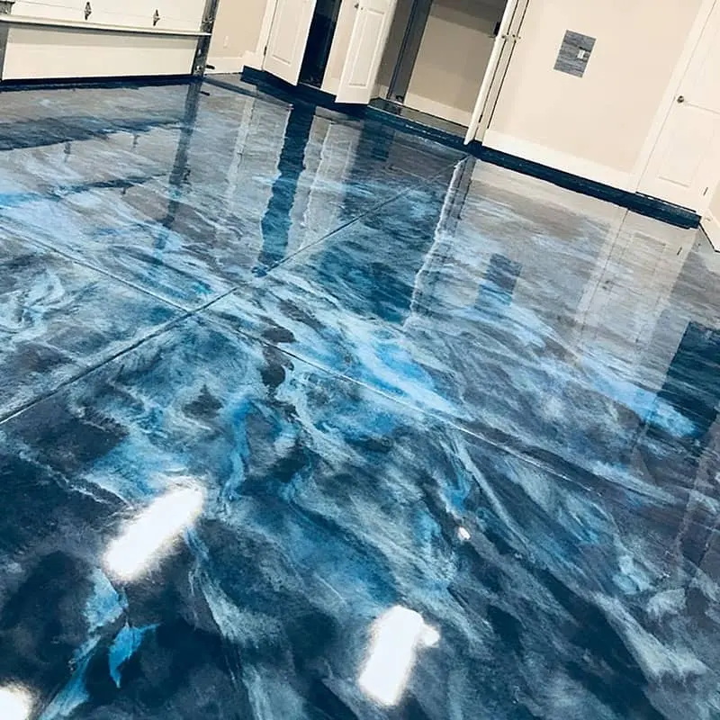 Blue metallic epoxy floor with marble effect installed in a Jeffersonville Indiana home